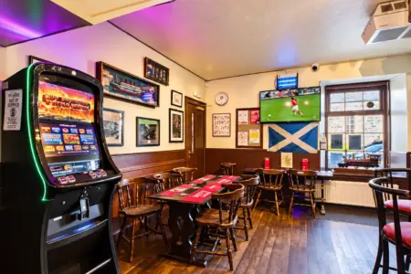 Cozy Scottish Pub with Slot Machine and Football TV