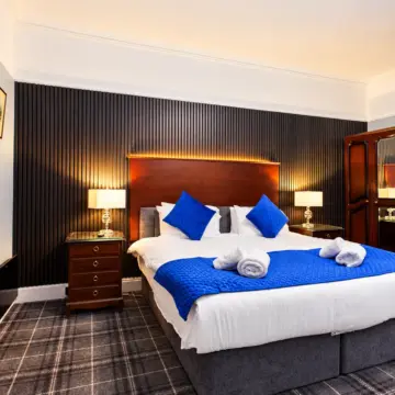 Elegant Blue-Accented Hotel Bedroom