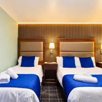 Symmetrical Blue-Accented Hotel Bedroom (1)