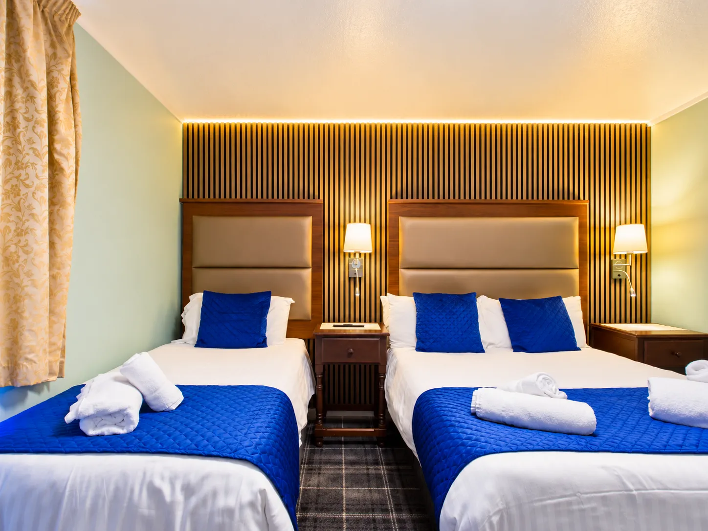 Symmetrical Blue-Accented Hotel Bedroom (1)